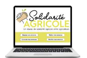 Un ordinateur portable avec, à l'écran, un outil de solidarité agricole
