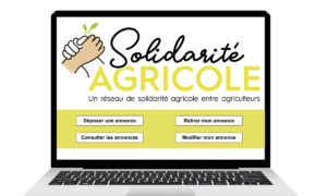 Un ordinateur portable avec, à l'écran, un outil de solidarité agricole